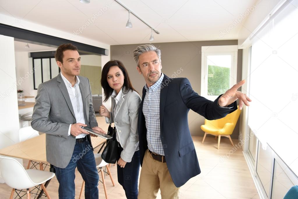 depositphotos_108511478-stock-photo-couple-with-agent-visiting-house